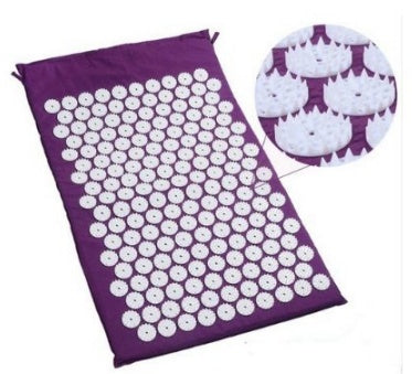Acupressure mat with white nodes on a purple bag, showing close-up detail.