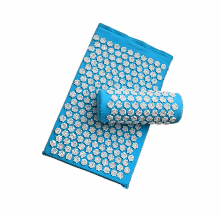 Blue acupressure mat with white dots on a white background