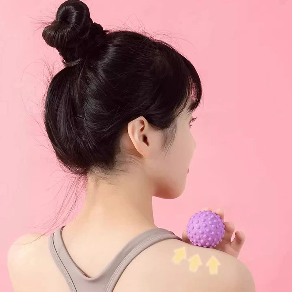 Massage ball for muscle tension relief used on shoulder